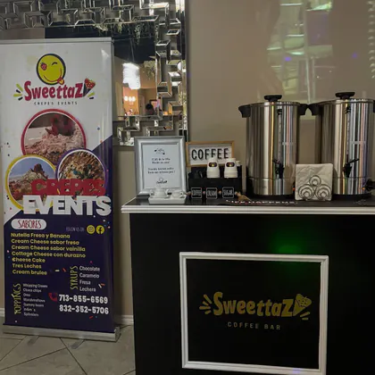 The Sweettaz Coffee Bar: two stainless coffee urns, cups, and coffee, cream and sugar on a black cart, beside a Sweettaz Crepes Events banner listing flavors and toppings